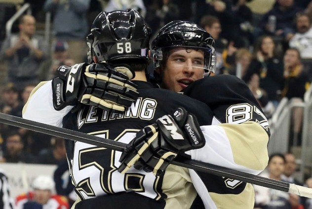 Oct 20, 2015; Pittsburgh, PA, USA; Pittsburgh Penguins center Sidney Crosby (87) celebrates his goal with defenseman Kris Letang (58) against the Florida Panthers during the first period at the CONSOL Energy Center. Mandatory Credit: Charles LeClaire-USA TODAY Sports
