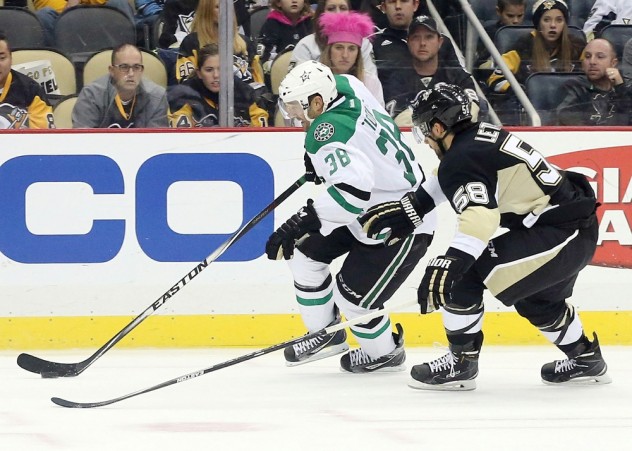 Oct 22, 2015; Pittsburgh, PA, USA; Dallas Stars center Vernon Fiddler (38) skates with the puck as Pittsburgh Penguins defenseman Kris Letang (58) chases during the third period at the CONSOL Energy Center. The Stars won 4-1. Mandatory Credit: Charles LeClaire-USA TODAY Sports