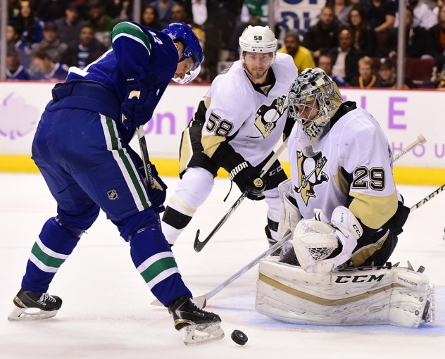 Nov 4, 2015; Vancouver, British Columbia, CAN; Vancouver Canucks forward Daniel Sedin (22) shoots the puck against Pittsburgh Penguins goaltender Marc-Andre Fleury (29) during the second period at Rogers Arena. Mandatory Credit: Anne-Marie Sorvin-USA TODAY Sports