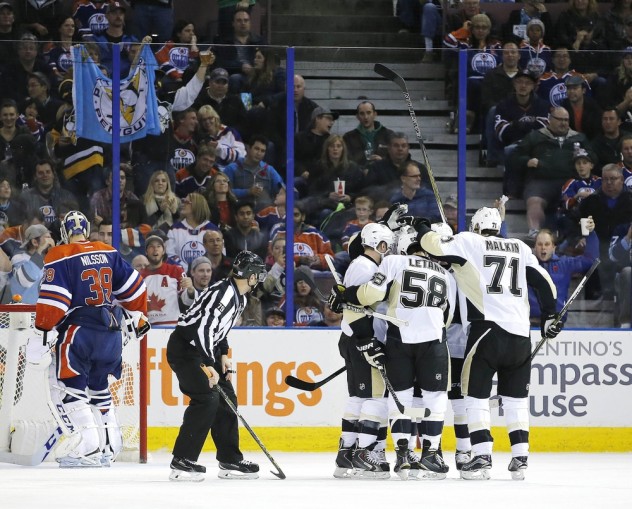 Nov 6, 2015; Edmonton, Alberta, CAN; The Pittsburgh Penguins celebrate a third period goal by Pittsburgh Penguins forward Phil Kessel (81) at Rexall Place. Mandatory Credit: Perry Nelson-USA TODAY Sports