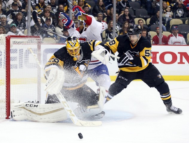 Nov 11, 2015; Pittsburgh, PA, USA; Pittsburgh Penguins goalie Marc-Andre Fleury (29) makes a save as Montreal Canadiens right wing Devante Smith-Pelly (middle) crashes the net and Penguins defenseman Kris Letang (58) defends during the third period at the CONSOL Energy Center. Mandatory Credit: Charles LeClaire-USA TODAY Sports