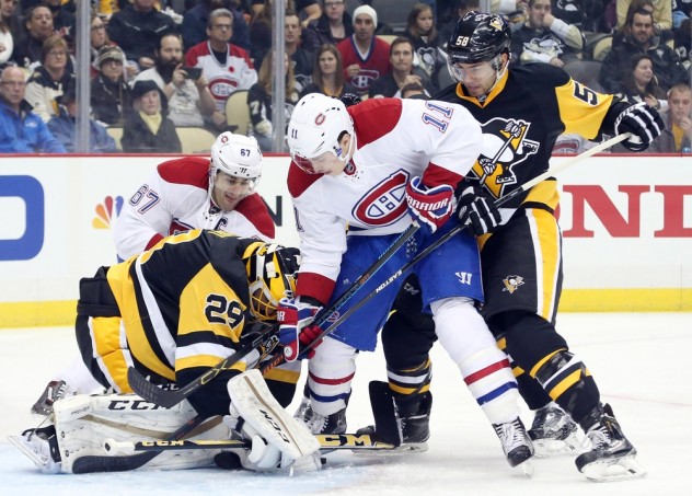 Nov 11, 2015; Pittsburgh, PA, USA; Pittsburgh Penguins goalie Marc-Andre Fleury (29) makes a save against Montreal Canadiens right wing Brendan Gallagher (11) as Pens Kris Letang (58) defends during the first period at the CONSOL Energy Center. Mandatory Credit: Charles LeClaire-USA TODAY Sports