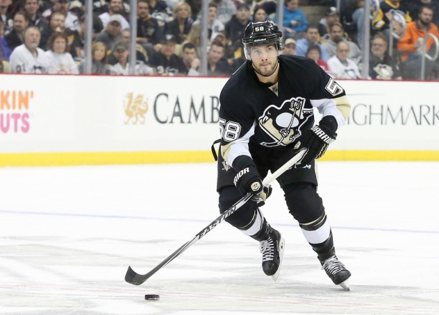 Nov 19, 2015; Pittsburgh, PA, USA; Pittsburgh Penguins defenseman Kris Letang (58) skates with the puck against the Colorado Avalanche during the second period at the CONSOL Energy Center. The Penguins won 4-3. Mandatory Credit: Charles LeClaire-USA TODAY Sports