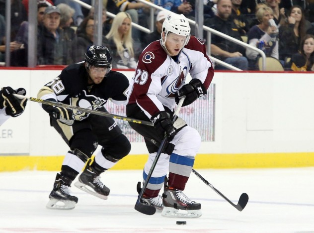 Nov 19, 2015; Pittsburgh, PA, USA; Colorado Avalanche center Nathan MacKinnon (29) skates with the puck as Pittsburgh Penguins defenseman Kris Letang (58) chases during the second period at the CONSOL Energy Center. The Penguins won 4-3. Mandatory Credit: Charles LeClaire-USA TODAY Sports