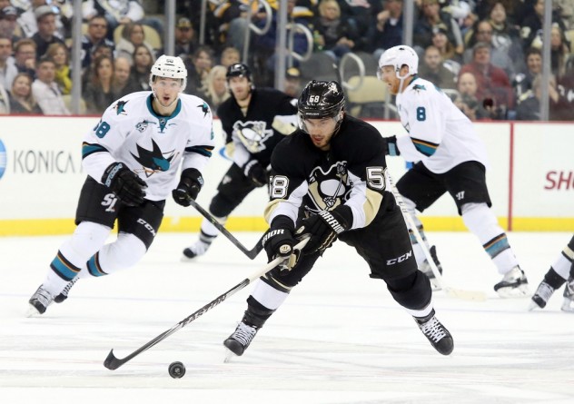 Nov 21, 2015; Pittsburgh, PA, USA; Pittsburgh Penguins defenseman Kris Letang (58) chases the puck against the San Jose Sharks during the third period at the CONSOL Energy Center. The Sharks won 3-1. Mandatory Credit: Charles LeClaire-USA TODAY Sports