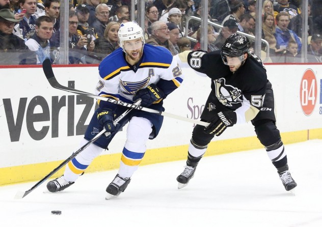 Nov 25, 2015; Pittsburgh, PA, USA; St. Louis Blues defenseman Alex Pietrangelo (27) handles the puck against pressure from Pittsburgh Penguins defenseman Kris Letang (58) during the first period at the CONSOL Energy Center. Mandatory Credit: Charles LeClaire-USA TODAY Sports