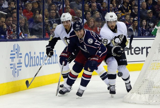 Nov 27, 2015; Columbus, OH, USA; Pittsburgh Penguins defenseman Kris Letang (58) steals the puck from Columbus Blue Jackets center Brandon Dubinsky (17) during the second period at Nationwide Arena. Mandatory Credit: Russell LaBounty-USA TODAY Sports