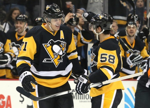 Nov 28, 2015; Pittsburgh, PA, USA; Pittsburgh Penguins center Evgeni Malkin (71) and defenseman Kris Letang (58) celebrate following Malkins second goal of the period against the Edmonton Oilers during the second period at the CONSOL Energy Center. Mandatory Credit: Charles LeClaire-USA TODAY Sports