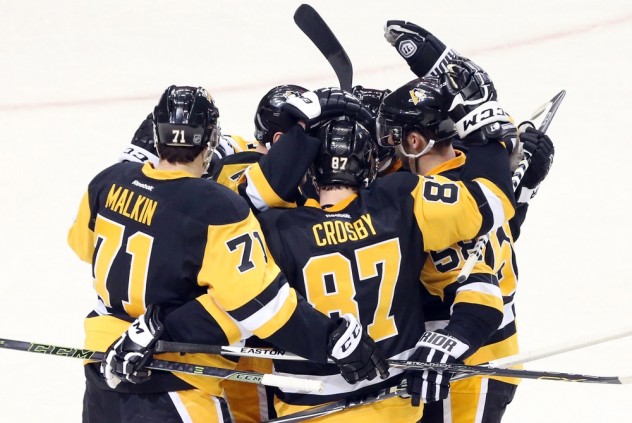 Jan 2, 2016; Pittsburgh, PA, USA; the Pittsburgh Penguins celebrate a power play goal by Pittsburgh Penguins center Sidney Crosby (87) against the New York Islanders during the second period at the CONSOL Energy Center. Mandatory Credit: Charles LeClaire-USA TODAY Sports