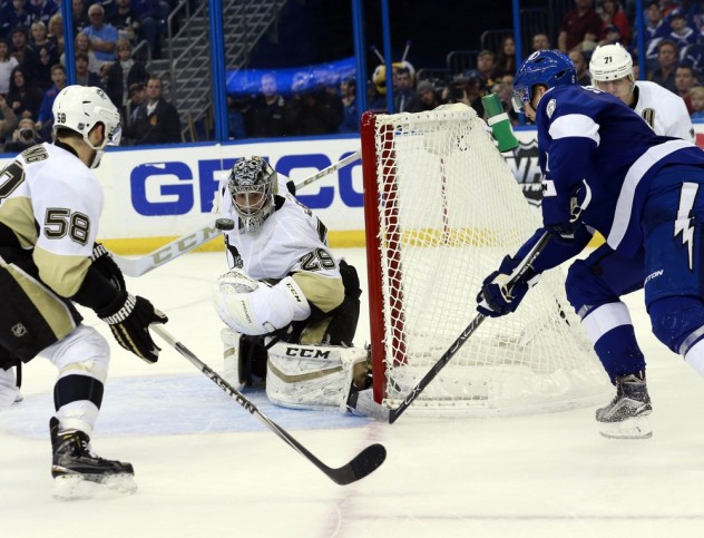 Jan 15, 2016; Tampa, FL, USA; Tampa Bay Lightning defenseman Anton Stralman (6) shoots as Pittsburgh Penguins goalie Marc-Andre Fleury (29) makes a save during overtime at Amalie Arena. Tampa Bay Lightning defeated the Pittsburgh Penguins 5-4. Mandatory Credit: Kim Klement-USA TODAY Sports