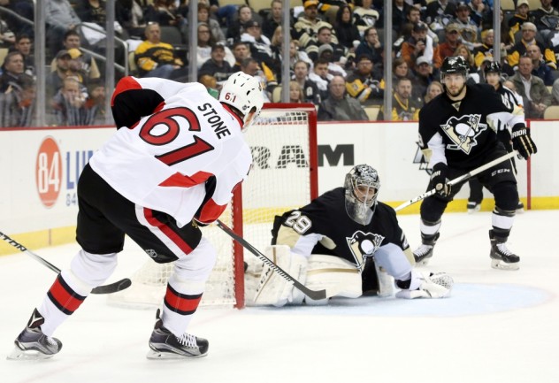 Feb 2, 2016; Pittsburgh, PA, USA; Ottawa Senators right wing Mark Stone (61) scores a goal against Pittsburgh Penguins goalie Marc-Andre Fleury (29) during the first period at the CONSOL Energy Center. Mandatory Credit: Charles LeClaire-USA TODAY Sports