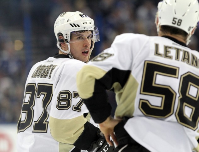 Feb 5, 2016; Tampa, FL, USA; Pittsburgh Penguins center Sidney Crosby (87) talks with defenseman Kris Letang (58) against the Tampa Bay Lightning during the second period at Amalie Arena. Mandatory Credit: Kim Klement-USA TODAY Sports