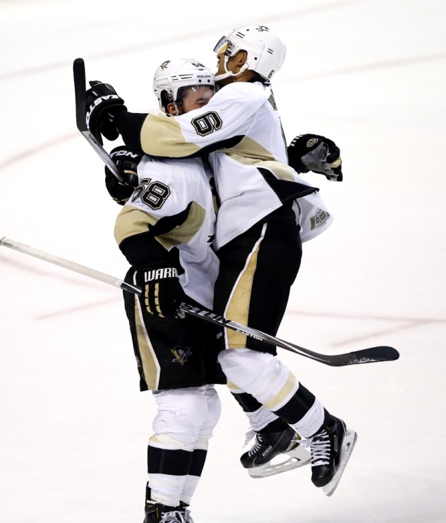 Feb 6, 2016; Sunrise, FL, USA; Pittsburgh Penguins defenseman Kris Letang (58) celebrates his game winning goal with  defenseman Trevor Daley (6) against the Florida Panthers in overtime at BB&T Center. The Penguins won 3-2. Mandatory Credit: Robert Mayer-USA TODAY Sports