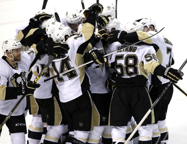Feb 6, 2016; Sunrise, FL, USA; Pittsburgh Penguins defenseman Kris Letang (58) celebrates his game winning goal against the Florida Panthers with teammates in overtime at BB&T Center. The Penguins won 3-2. Mandatory Credit: Robert Mayer-USA TODAY Sports