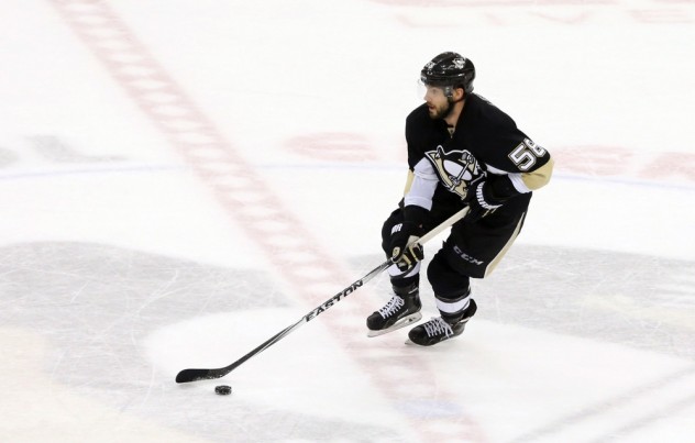 Feb 20, 2016; Pittsburgh, PA, USA; Pittsburgh Penguins defenseman Kris Letang (58) skates through center ice with the puck against the Tampa Bay Lightning during the second period at the CONSOL Energy Center. Tampa Bay won 4-2. Mandatory Credit: Charles LeClaire-USA TODAY Sports