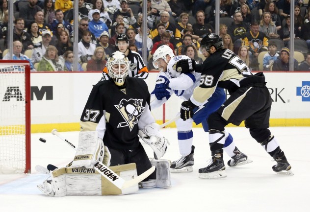 Feb 20, 2016; Pittsburgh, PA, USA; Tampa Bay Lightning center Steven Stamkos (middle) scores behind Pittsburgh Penguins goalie Jeff Zatkoff (37) as Pens defenseman Kris Letang (58) defends during the first period at the CONSOL Energy Center. The goal was the 300th career NHL goal for Stamkos. Tampa Bay won 4-2. Mandatory Credit: Charles LeClaire-USA TODAY Sports
