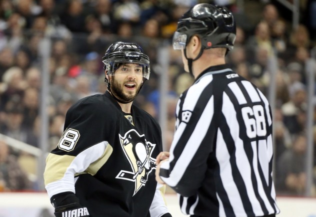 Feb 20, 2016; Pittsburgh, PA, USA; Pittsburgh Penguins defenseman Kris Letang (58) reacts at linesman Scott Driscoll (68) after Letang was penalized for using an illegal stick against the Tampa Bay Lightning during the third period at the CONSOL Energy Center. Tampa Bay won 4-2. Mandatory Credit: Charles LeClaire-USA TODAY Sports