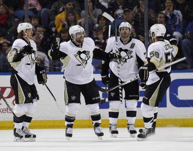 Feb 21, 2016; Buffalo, NY, USA; Pittsburgh Penguins right wing Phil Kessel (81) celebrates with his team after scoring a goal against the Buffalo Sabres during the second period at First Niagara Center. Mandatory Credit: Kevin Hoffman-USA TODAY Sports