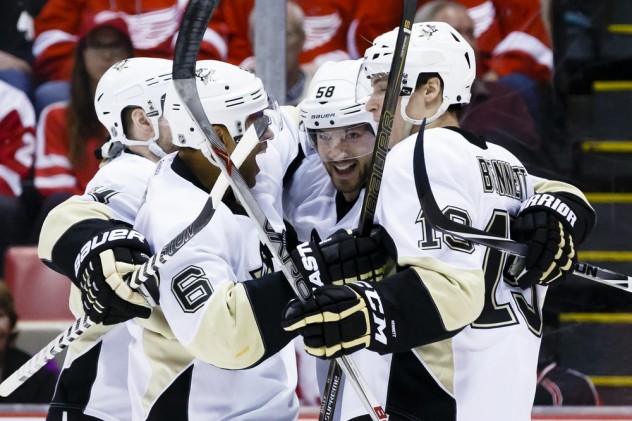 Mar 26, 2016; Detroit, MI, USA; Pittsburgh Penguins defenseman Kris Letang (58) celebrates with teammates after scoring in the second period against the Detroit Red Wings at Joe Louis Arena. Mandatory Credit: Rick Osentoski-USA TODAY Sports