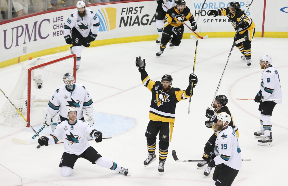 May 30, 2016; Pittsburgh, PA, USA; Pittsburgh Penguins center Nick Bonino (13) celebrates after scoring the game-winning goal against the San Jose Sharks in the third period game one of the 2016 Stanley Cup Final at Consol Energy Center. Mandatory Credit: Charles LeClaire-USA TODAY Sports