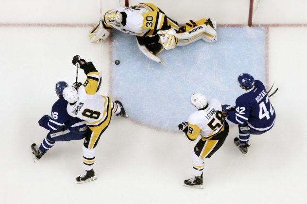 Nov 12, 2016; Pittsburgh, PA, USA; Pittsburgh Penguins goalie Matt Murray (30) makes a save as defenseman Brian Dumoulin (8) and defenseman Kris Letang (58) defend Toronto Maple Leafs center Mitchell Marner (16) and center Tyler Bozak (42) during the second period against at the PPG Paints Arena. Pittsburgh won 4-1. Mandatory Credit: Charles LeClaire-USA TODAY Sports