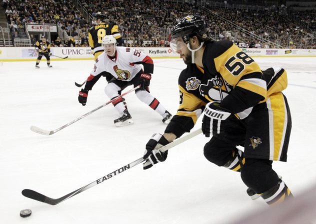 Dec 5, 2016; Pittsburgh, PA, USA;  Pittsburgh Penguins defenseman Kris Letang (58) skates with the puck against the Ottawa Senators during the second period at the PPG PAINTS Arena. The Penguins won 8-5. Mandatory Credit: Charles LeClaire-USA TODAY Sports