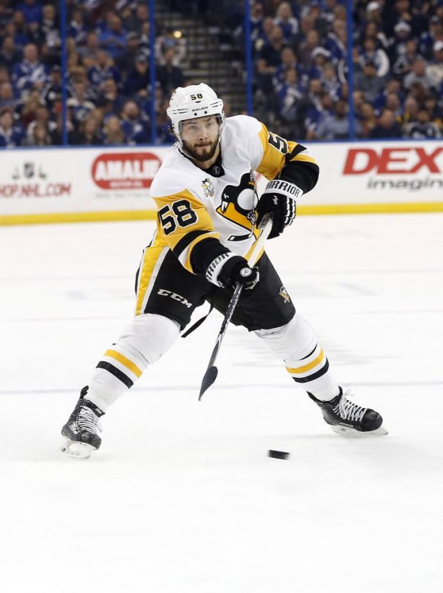 Dec 10, 2016; Tampa, FL, USA; Pittsburgh Penguins defenseman Kris Letang (58) passes the puck against the Tampa Bay Lightning during the first period at Amalie Arena. Mandatory Credit: Kim Klement-USA TODAY Sports