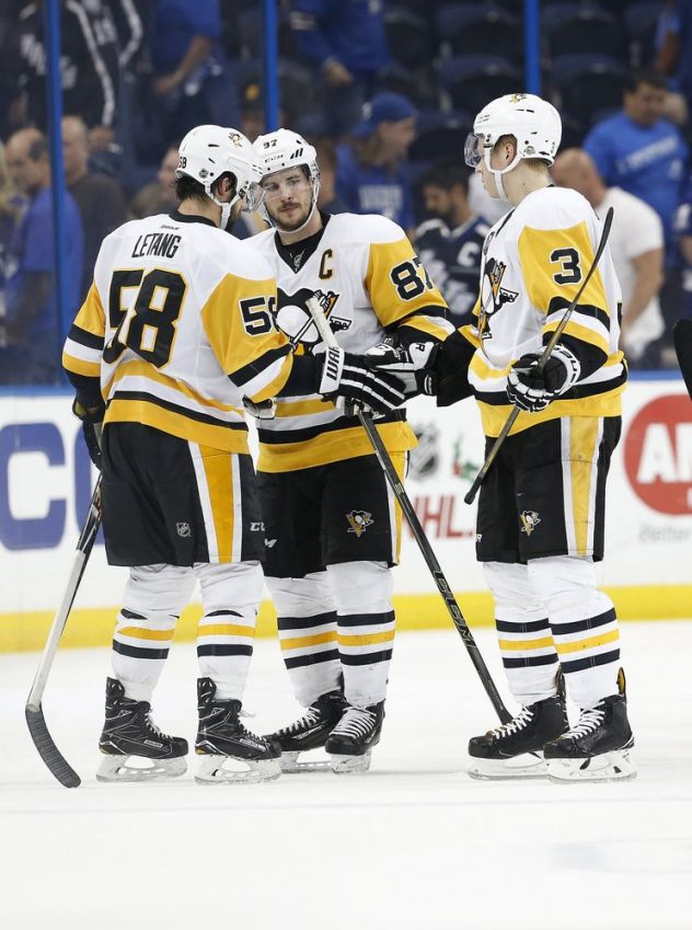 Dec 10, 2016; Tampa, FL, USA; Pittsburgh Penguins center Sidney Crosby (87), defenseman Kris Letang (58) and defenseman Olli Maatta (3) congratulate each other asftr they beat the Tampa Bay Lightning at Amalie Arena. Pittsburgh Penguins defeated the Tampa Bay Lightning 4-3. Mandatory Credit: Kim Klement-USA TODAY Sports