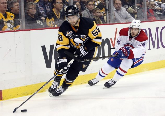 Dec 31, 2016; Pittsburgh, PA, USA; Pittsburgh Penguins defenseman Kris Letang (58) skates after the puck ahead of Montreal Canadiens left wing Phillip Danault (24) during the first period at the PPG PAINTS Arena. Mandatory Credit: Charles LeClaire-USA TODAY Sports