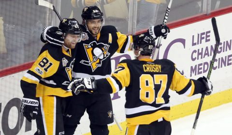 Feb 3, 2017; Pittsburgh, PA, USA;  Pittsburgh Penguins right wing Phil Kessel (81) and defenseman Kris Letang (58) and center Sidney Crosby (87) celebrate after Kessel scored a game winning power play goal in overtime to defeat the Columbus Blue Jackets at the PPG PAINTS Arena. The Penguins won 4-3 in overtime. Mandatory Credit: Charles LeClaire-USA TODAY Sports