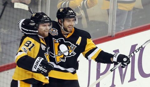 Feb 3, 2017; Pittsburgh, PA, USA;  Pittsburgh Penguins right wing Phil Kessel (81) and defenseman Kris Letang (58) celebrate after Kessel scored a game winning power play goal in overtime to defeat the Columbus Blue Jackets  at the PPG PAINTS Arena. The Penguins won 4-3 in overtime. Mandatory Credit: Charles LeClaire-USA TODAY Sports