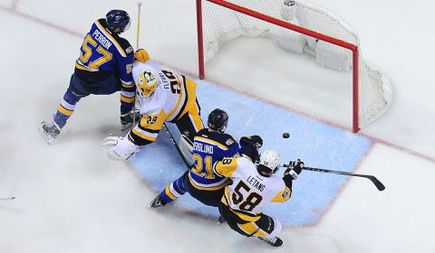 Feb 4, 2017; St. Louis, MO, USA; Pittsburgh Penguins goalie Marc-Andre Fleury (29) and defenseman Kris Letang (58) defend the net against St. Louis Blues left wing David Perron (57) and center Patrik Berglund (21) during the third period at Scottrade Center. The Penguins won 4-1. Mandatory Credit: Jeff Curry-USA TODAY Sports