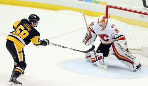 Feb 7, 2017; Pittsburgh, PA, USA; Calgary Flames goalie Chad Johnson (31) makes a save against Pittsburgh Penguins defenseman Kris Letang (58) to secure a shootout win at the PPG PAINTS Arena. Calgary won 3-2 in a shootout. Mandatory Credit: Charles LeClaire-USA TODAY Sports