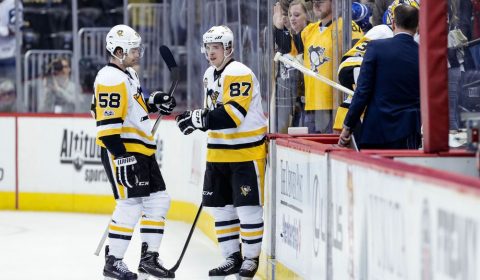 Feb 9, 2017; Denver, CO, USA; Pittsburgh Penguins center Sidney Crosby (87) celebrates with defenseman Kris Letang (58) after the game against the Colorado Avalanche at the Pepsi Center. The Penguins won 4-1. Mandatory Credit: Isaiah J. Downing-USA TODAY Sports