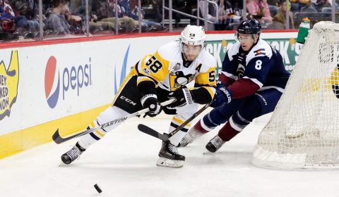 Feb 9, 2017; Denver, CO, USA; Pittsburgh Penguins defenseman Kris Letang (58) and Colorado Avalanche center Joe Colborne (8) battle for the puck in the second period at the Pepsi Center. Mandatory Credit: Isaiah J. Downing-USA TODAY Sports