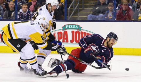 Feb 17, 2017; Columbus, OH, USA; Pittsburgh Penguins defenseman Brian Dumoulin (8) and defenseman Kris Letang (58) defend against Columbus Blue Jackets left wing Nick Foligno (71) shoots the puck in the second period at Nationwide Arena. Mandatory Credit: Aaron Doster-USA TODAY Sports