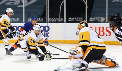 Casey DeSmith #1 of the Pittsburgh Penguins makes the save against the New York Islanders during the first period