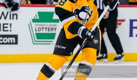 PITTSBURGH, PA - MARCH 04: Pittsburgh Penguins defenseman Kris Letang (58) passes the puck during the second period in the NHL game between the Pittsburgh Penguins and the Philadelphia Flyers on March 4, 2021, at PPG Paints Arena in Pittsburgh, PA.